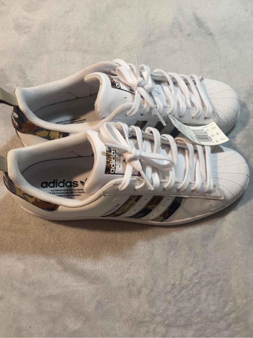 adidas Women’s White Superstar Sneakers with Camo Accent Stripes